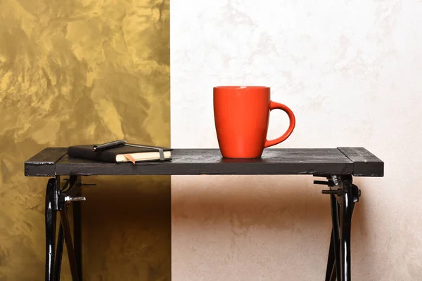 Cup of tea or coffee and diary on stylish background. — Stock Photo, Image