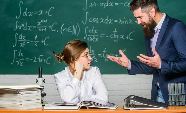 Conflict situation. School conflict. Demanding lecturer. Teacher strict serious bearded man having conflict with student girl. Man unhappy communicating. School principal talking about punishment