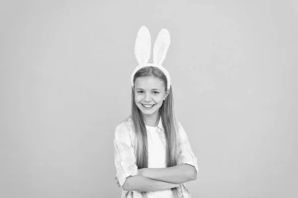 Looking kind of funny. Small girl child in easter bunny style. Fashion accessory for easter costume party. Looking pretty in easter bunny attire. Cute little girl wearing bunny ears headband — Stock Photo, Image