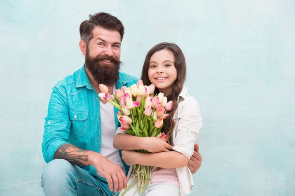 International womens day. Flower shop. Family tradition. Cherishing femininity. 8 march. Tulips for daughter. Man tulips bouquet. Father giving tulips girl. Dad with flowers. Birthday celebration — Stock Photo, Image