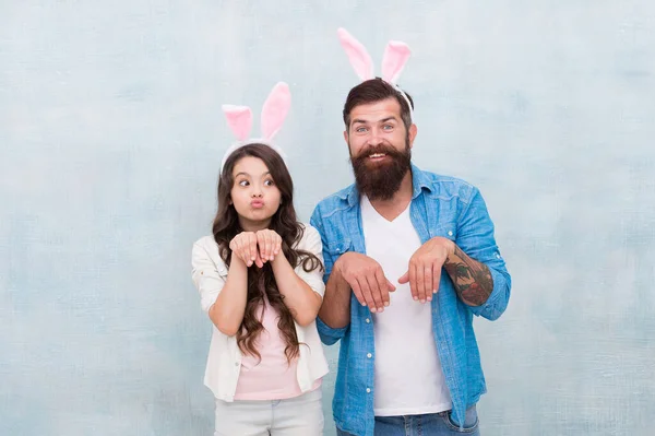 Spring holiday. Easter activities for family. Happy easter. Holiday bunny long ears. Family tradition concept. Dad and daughter bunny ears. Father and child celebrate easter. April sale concept