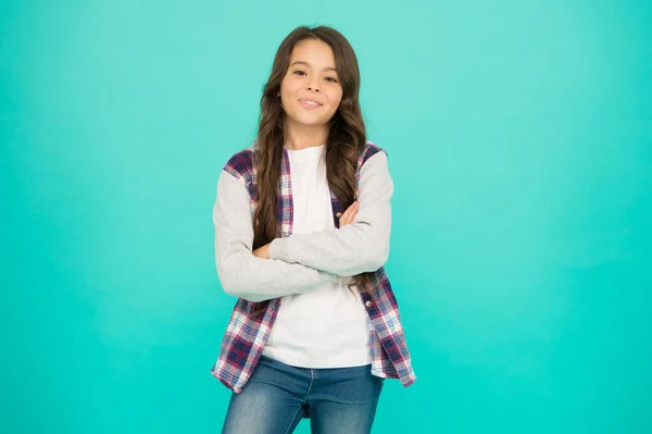 Positive vibes. Totally satisfied. Shopping day. Feeling cool. Cute girl with long hair. Small girl curly hairstyle. International childrens day. Little girl turquoise background. Good mood concept — Stock Photo, Image