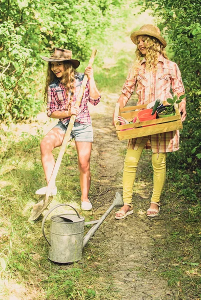 Kids girls with tools for gardening. Gardening basics. Gardening teaching life cycle process. Summer at countryside. Gardens great place cultivate meaningful and fun learning experience for children — Stock Photo, Image