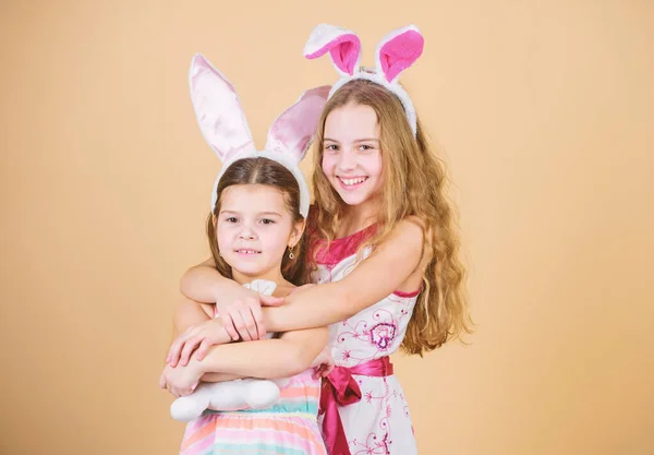 Easter day. Easter activities for children. Happy easter. Holiday bunny girls with long bunny ears. Children bunny costume. Playful girls sisters celebrate easter. Spring holiday. Happy childhood
