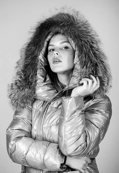 Faux fur. Warming up. Casual winter jacket slightly more stylish and have more comfort features such as larger hood fur trim on hood. Fashion girl winter clothes. Fashion trend. Fashion coat and hat