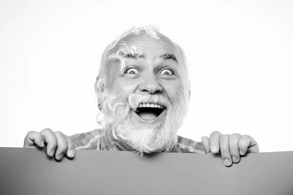 Pillow party. Soft feathers on his cheeks. Facial hair. Feathers madness. Man bearded mature emotional face with stuck white feathers close up. Funny pensioner going crazy. Advertisement concept — Stock Photo, Image