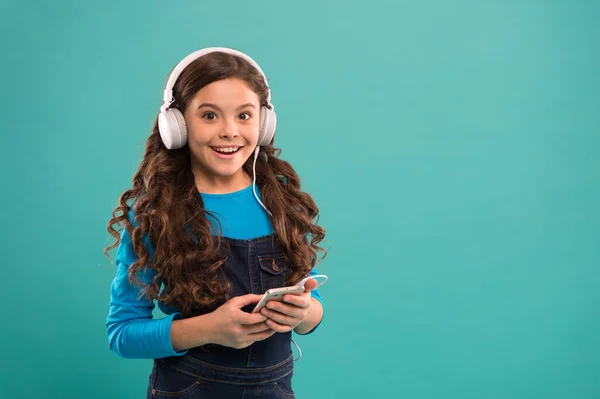 Modern gadgets. Girl listen music modern headphones and smartphone. Listen for free. Music subscription. Enjoy music concept. Music app. Audio book. Educative content. Study language audio lessons