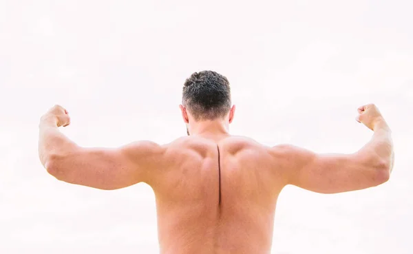 I can do everything. Man with muscular body. Man or sportsman flexing arms with fists, back view. muscular back man isolated on white. Success concept. Strong muscles and power — Stock Photo, Image