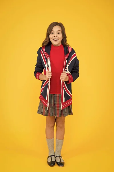 Do you speak english. go study to england. learn english language. british school in england. vacation in great britain. travel. Union Jack Flag. small girl uniform. kid with english flag on jacket