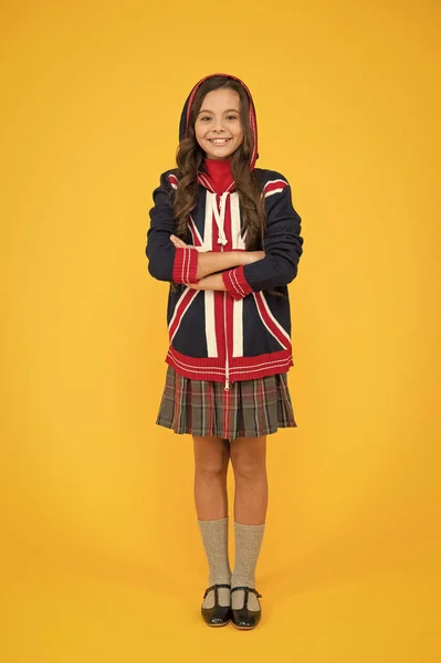 English lesson. Union Jack Flag. small girl uniform. kid with english flag on jacket. go study to england. learn english language. british school in england. vacation in great britain. travel concept