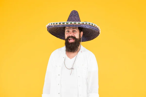 Mexican party. man in mexican sombrero hat. Celebrate traditions. hipster with beard in festive sombrero. celebrating fiesta. happy man wear poncho. having fun on mexican party. sombrero party man