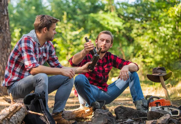 On An Adventure. man best friend drink beer. ranger at outdoor activities. spend picnic weekend nature. Tourism concept. hike and people. two men relax in forest. hiking and camping. male friendship
