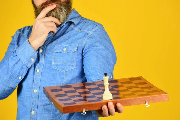 Board game. level up your iq. bearded man hold chess board. intelligence quotient concept. human brain working. brainstorming concept. play chess tournament. Intelligence level measurement