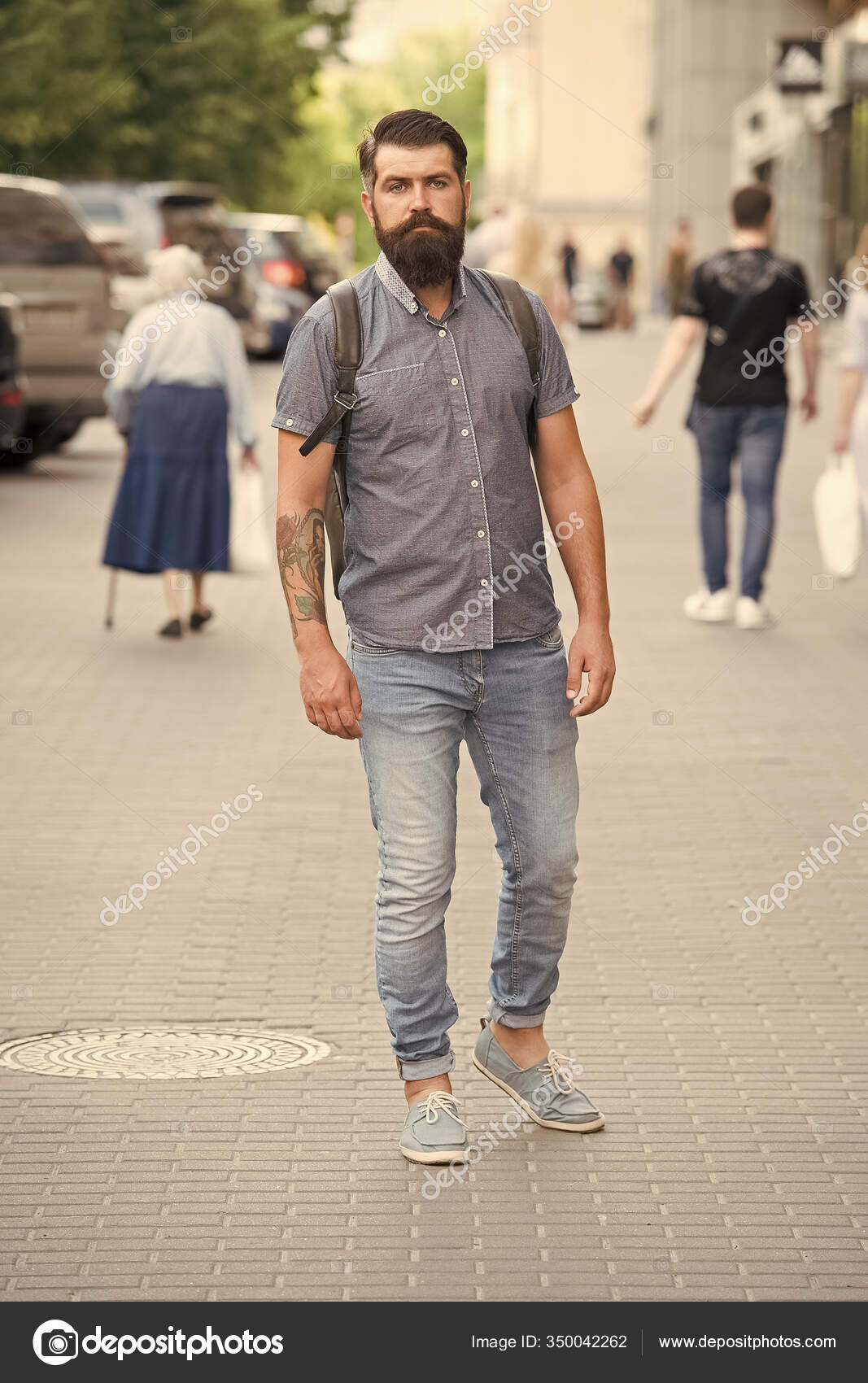 Mature hipster with beard. Bearded man walking on street. modern