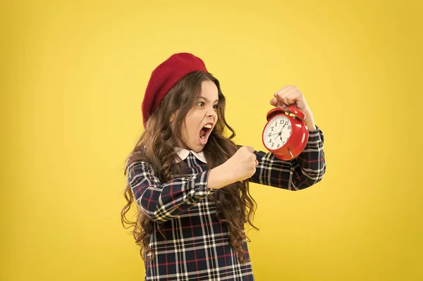 It is time. Always on time. It is never too late. Define your own rhythm of life. Happy hours concept. Schedule and timing. Girl with alarm clock. Set up alarm clock. Child little girl hold red clock