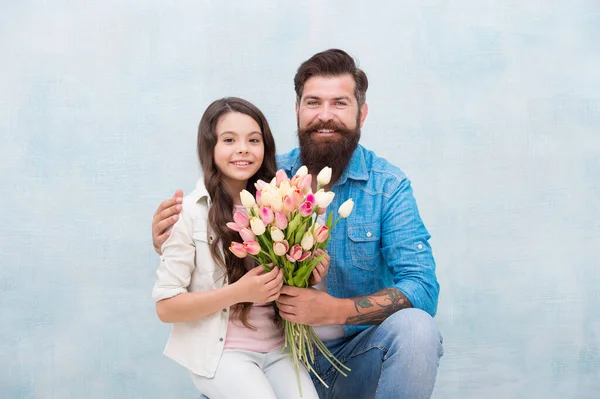 Flower shop. Family tradition. Parenthood. My little baby. Tender tulips for daughter. Man tulips bouquet. Father giving tulips girl. Dad with flowers. Birthday celebration. International womens day — Stock Photo, Image