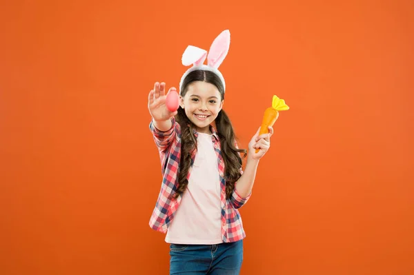 You are my bunny. having fun on spring holiday. Easter eggs and cute bunny. happy easter. small girl wear bunny ears. kid on easter egg hunt. happy child hold painted egg and carrot — Stock Photo, Image