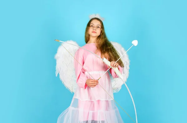 Valentines day angel. Amour. God of love. February 14. valentine sale and discount. Cupid shoot with bow. Arrow of love. small angel girl with wings and halo. Cupid throws arrow with bow