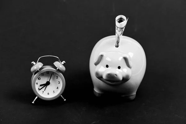 Financial crisis. Banking account. Bankruptcy and debt. Pay for debt. Bank collector service. Credit debt. Economics and finance. It is time to pay. Piggy bank stuffed dollar cash and alarm clock