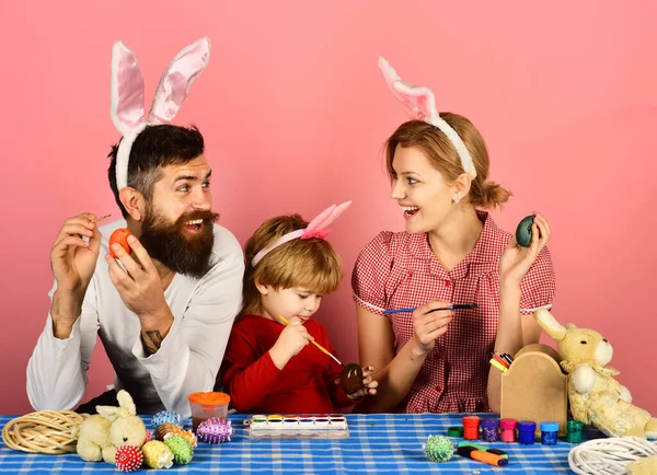 Family members wearing bunny ears. Mother, father and daughter