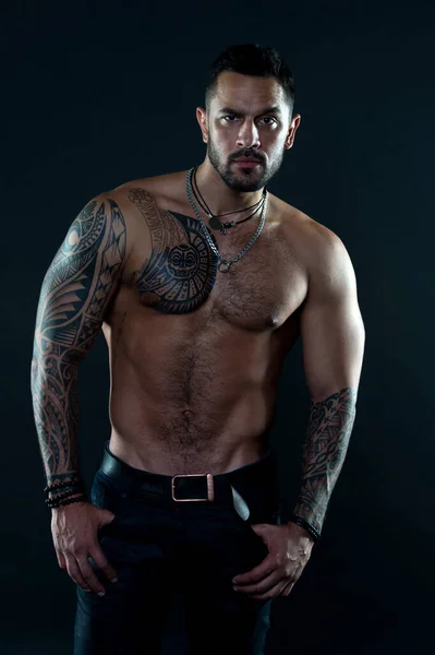 Jewelry for real men. Bearded man with tattooed torso. Macho sexy bare torso. Fit model with tattoo art skin. Sportsman or athlete with beard and hair. Sport and fitness. Masculinity. Muscular torso — Stock Photo, Image