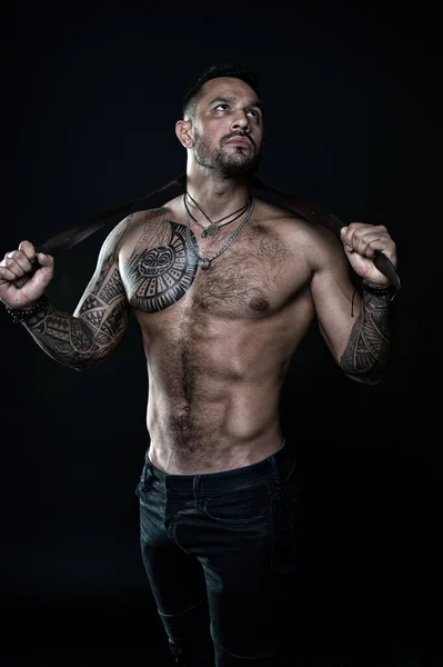 Fitness model topless. healthcare lifestyle. body strong abs. Wild masculine beauty. macho. brutal and sexy. muscular bodybuilder with body tattoo. athletic male hold strong belt. full of power — Stock Photo, Image