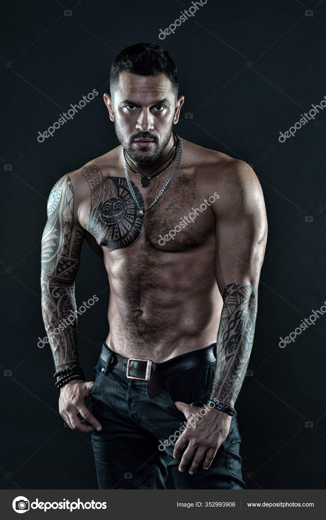 Be strong. muscular bodybuilder with body tattoo. athletic male show  abdominal muscles. fitness model topless. healthcare lifestyle. body strong  abs. Wild masculine beauty. macho. brutal and sexy Stock Photo by ©stetsik  352993906