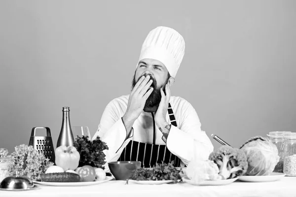 Healthy breakfast. Vitamin. man use kitchenware. Professional chef in cook uniform. Dieting with organic food. Fresh vegetables. tired bearded man cooking in kitchen. Healthy food and vegetarian