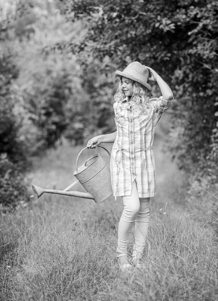 Kid gardening. earth day. environment ecology. nature protection. little girl farmer care plants. farming and agriculture. spring country side village. summer season. small girl with watering can — Stock Photo, Image