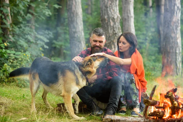 Couple in love, young happy family spend leisure with dog. — Stock Photo, Image