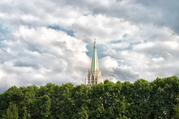 Overrated tourist attractions. Building tower and spire. architecture and design. Summer city tour. Vacation destinations. Explore european architecture. Tower on cloudy sky. High beautiful tower — Stock Photo, Image