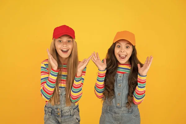 What a surprise. Surprised girls with open mouth in surprise on yellow background. Happy little children looking with surprise. Surprise and sensation — Stock Photo, Image