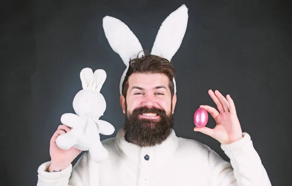 Soft and tender. Guy with long bunny or rabbit ears on black background. Enjoy tenderness. Easter vibes. Man handsome face wear white bunny ears. Easter bunny. White bunny symbol of easter holiday — Stock Photo, Image