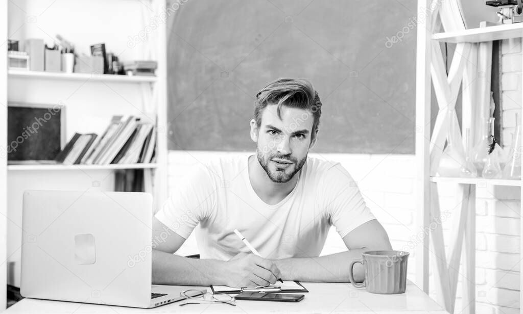job search. back to school. Working day morning. college life. school teacher use laptop and phone. man make note and drink coffee. modern education concept. student man in classroom with tea cup