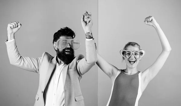 Corporate culture. Diving into celebration. Playful businessman and colleague celebrating. Celebrating holiday. Bearded man pretty woman party goggles celebrating. Couple having fun. Office party