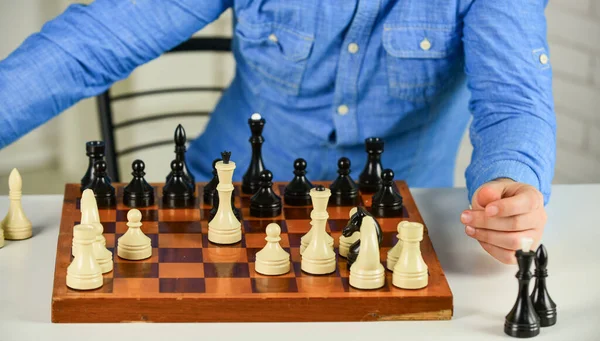Intellectual hobby. Figures on wooden chess board. Thinking about next step. Strategy concept. School teacher. Board game. Playing chess. Development logics. Chess is life in miniature. Chess lesson