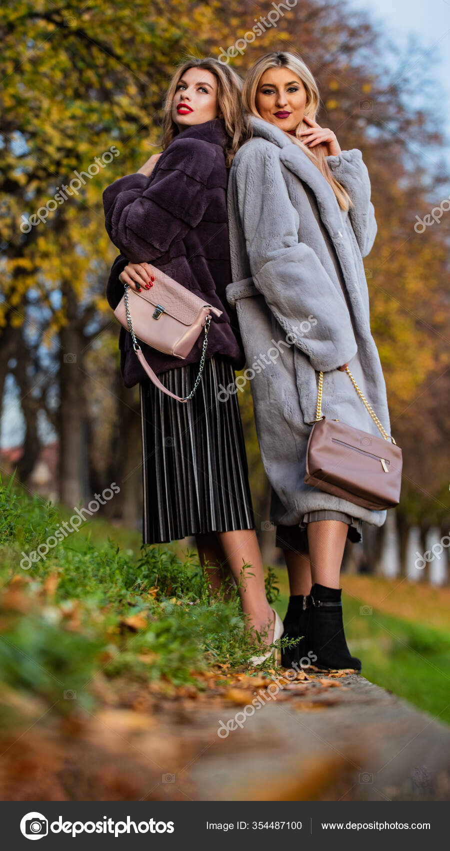 Fall outfit. Beautiful ladies walking in warm clothes. Gorgeous girls.  Beauty and fashion concept. Difference between faux and real fur. Visual  aesthetics. Benefits wearing fur. Women wear fur coats Stock Photo by ©