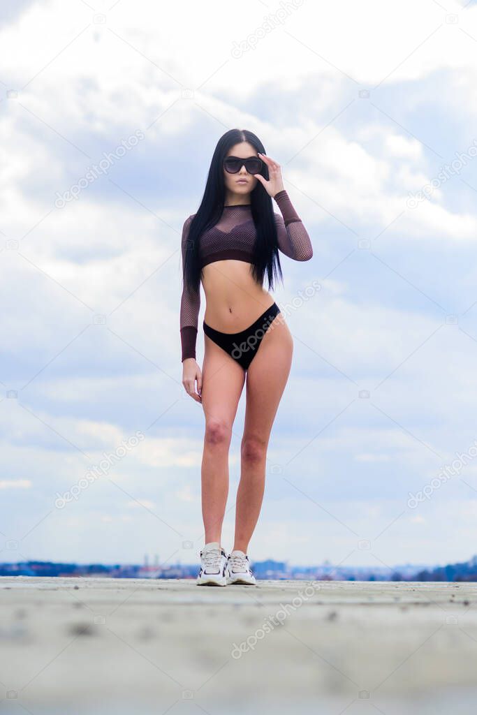 abs. freedom. sensual girl in underwear lingerie and sunglasses outdoor. sexy woman with fit body. sport fitness. summer fashion beauty. perfect body with no cellulite and fat. sexy abs. female abs
