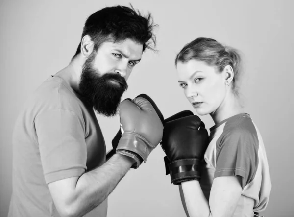 Couple girl and hipster practicing boxing. Sport for everyone. Amateur boxing club. Equal possibilities. Strength and power. Man and woman in boxing gloves. Be careful. Boxing sport concept