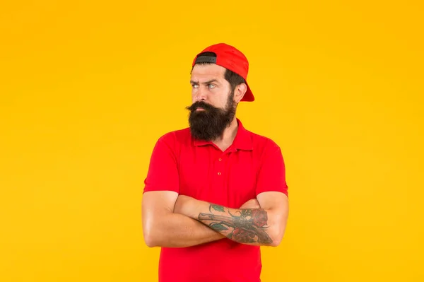Cool and free man. Serious man yellow background. Bearded man keep hands crossed with confidence. Caucasian man with mustache and beard hair. Barbershop. Fashion and style. Hipster lifestyle — Stock Photo, Image
