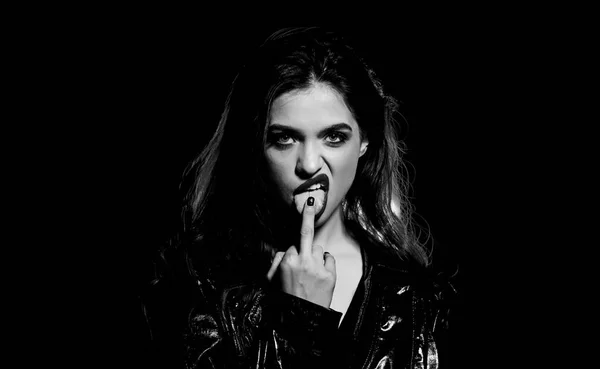 Hot rude girl licking middle finger gesture. Fashion industry. Fashion lady. Desire concept. Wild energy. Impeccable appearance. Mysterious passionate fashion model. Sexy attractive woman makeup face — Stock Photo, Image