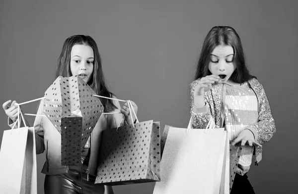Shopping day happiness. Sisters shopping together. Buy clothes. Fashionista addicted buyer. Fashion boutique kids. Shopping of her dreams. Happy children in shop with bags. Shopping is best therapy — Stock Photo, Image