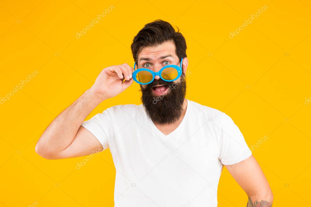 Accessorize your eyesight. Cool guy wear eyeglasses yellow background. Hipster look through fancy eyeglasses. Fashion eyeglasses. Prescription glasses. Eyewear. Choose eyeglasses in trendy style