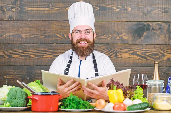Happy bearded man. chef recipe. Cuisine culinary. Vitamin. Healthy food cooking. Mature hipster with beard. Dieting organic food. Vegetarian salad with fresh vegetables. Slice of summer goodness