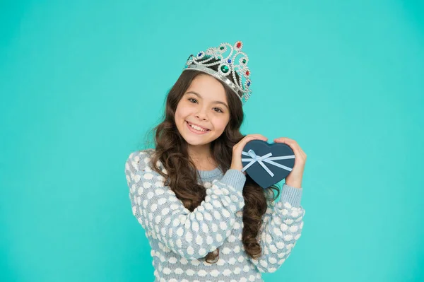 my first prize. gift with love. happy valentines day. child with heart shaped box. Welcome to world of luxury. Little princess. Girl wear crown. Award concept. girl in crown holding birthday gift box