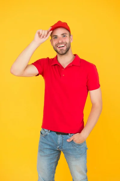 Service concept. portrait of smiling deliveryman. job and people concept. side job for student. wanted for barista in cafe. service industry staff. small business owner wearing red polo style shirt — Stock Photo, Image