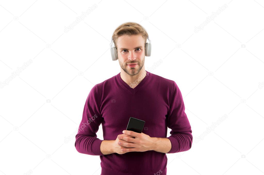 change musical track on mobile phone. confident guy open playlist on mp3 player. charismatic music lover. handsome unshaven man isolated on white. man listen music in earphones