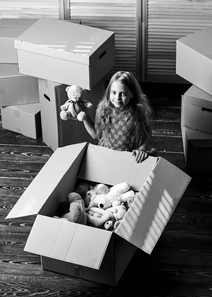 Box package and storage. Small child prepare toys for relocation. Kid girl relocating boxes background. Relocating concept. Delivery service. Happy childhood. Relocating family stressful for kids — Stock Photo, Image