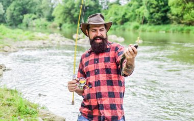 Follow your Own passion. hobby and sport activity. bearded fisher in water. summer weekend. Successful fly fishing. mature man fly fishing. man catching fish. fisherman show fishing technique use rod clipart