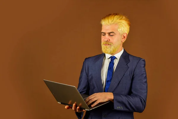 stylish man networking. Businessman pc notebook at office. internet technology in modern business. bearded man use laptop. working with computer. living in digital world. Successful business